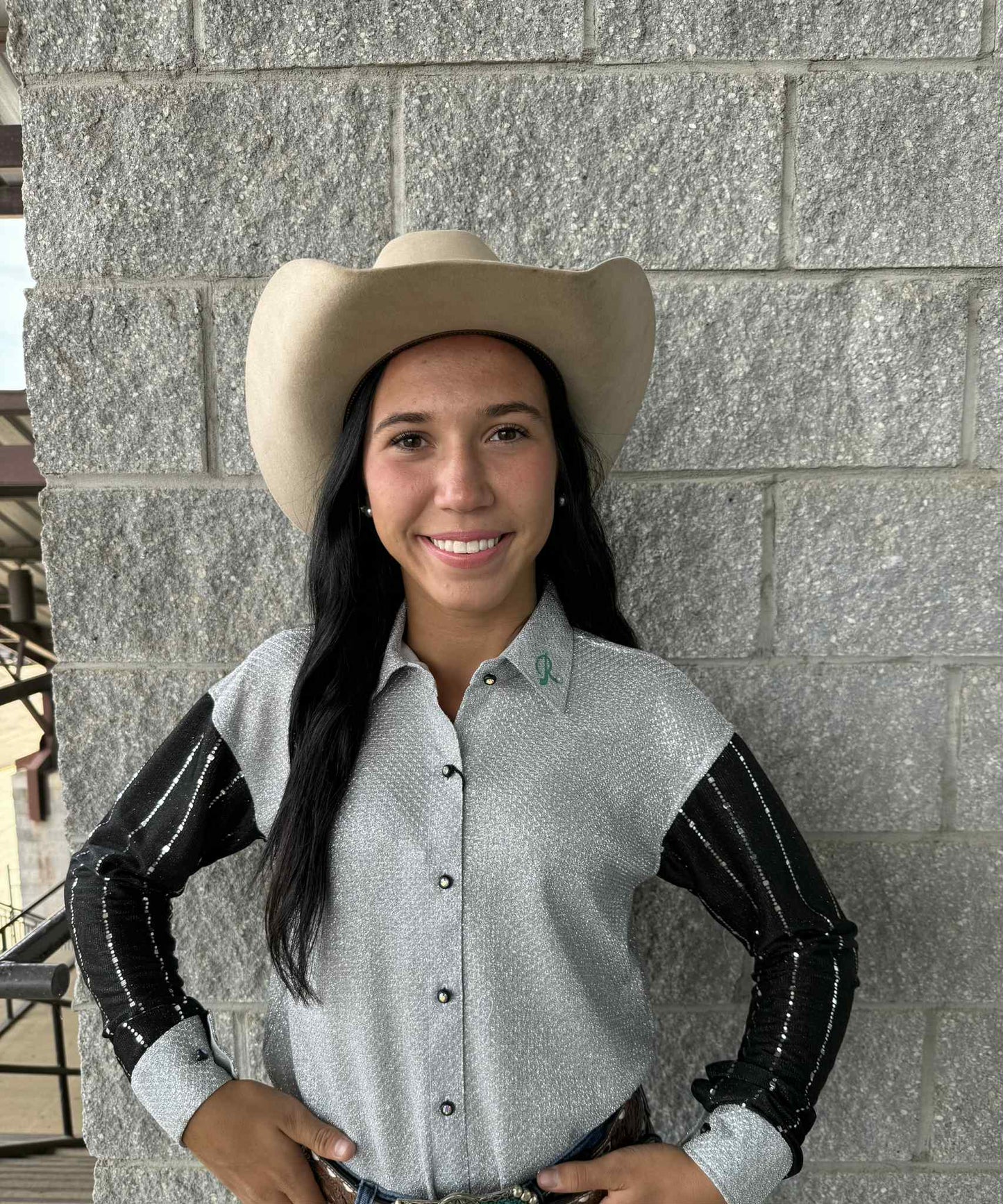 Cowgirl wearing The Ranch Midnight Silver Show Shirt with glitter black sleeves and silver shimmer body