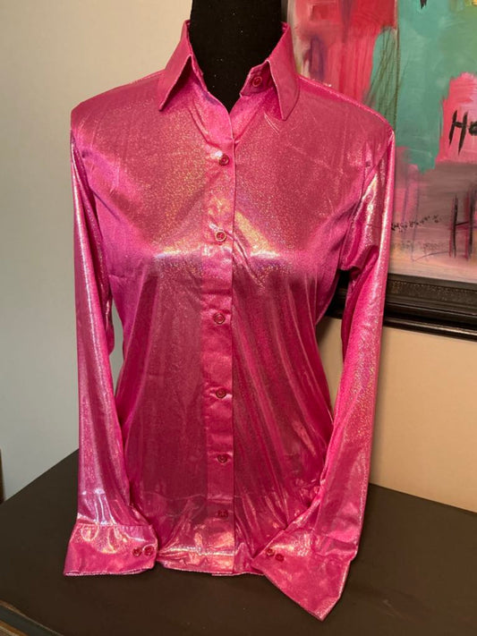 This image is of a hot pink rodeo show shirt that sparkles when the light hits it.