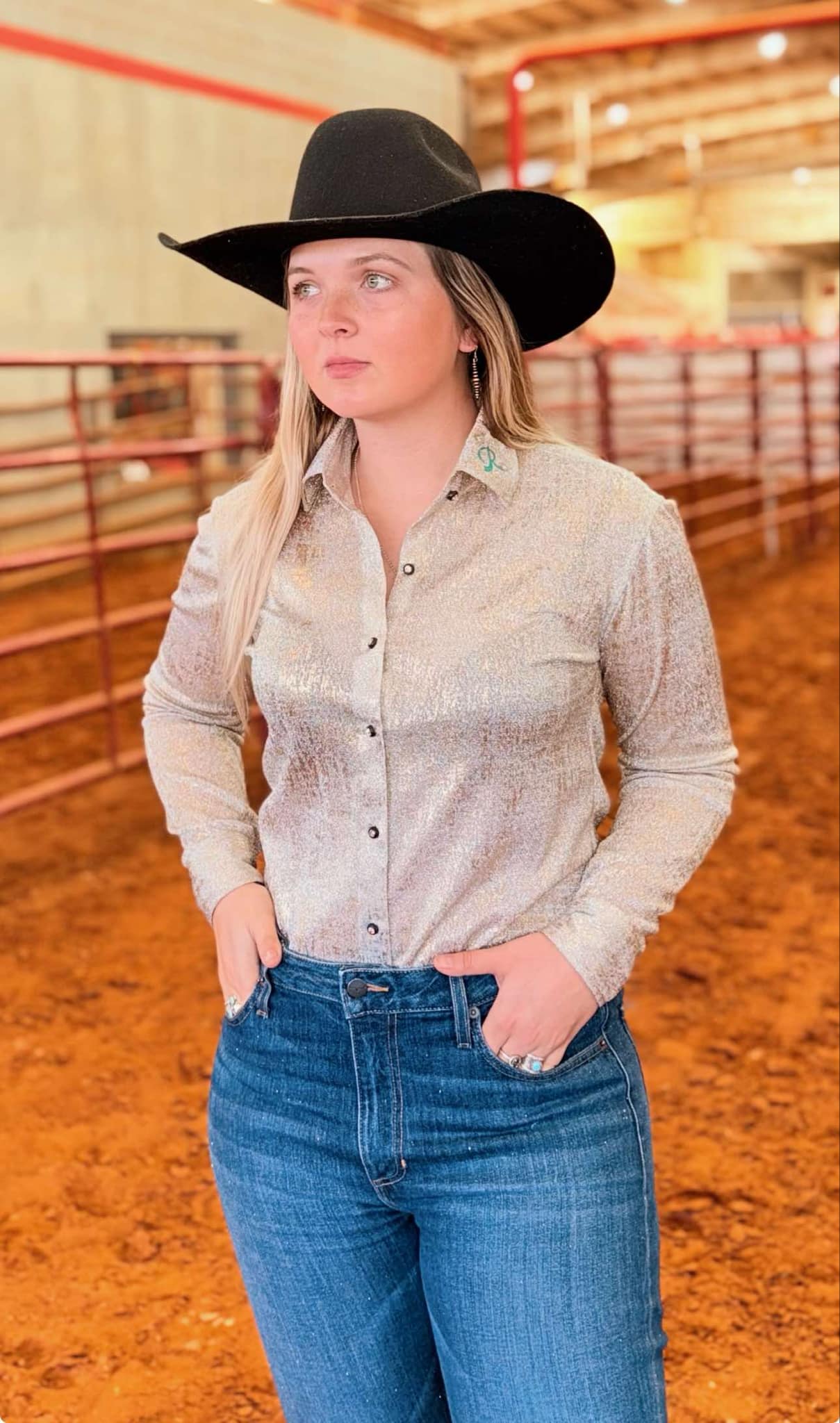 A barrel racing show shirt in metallic gold shimmer with a flattering fit, perfect for performances and events. Features subtle sparkle and premium materials.